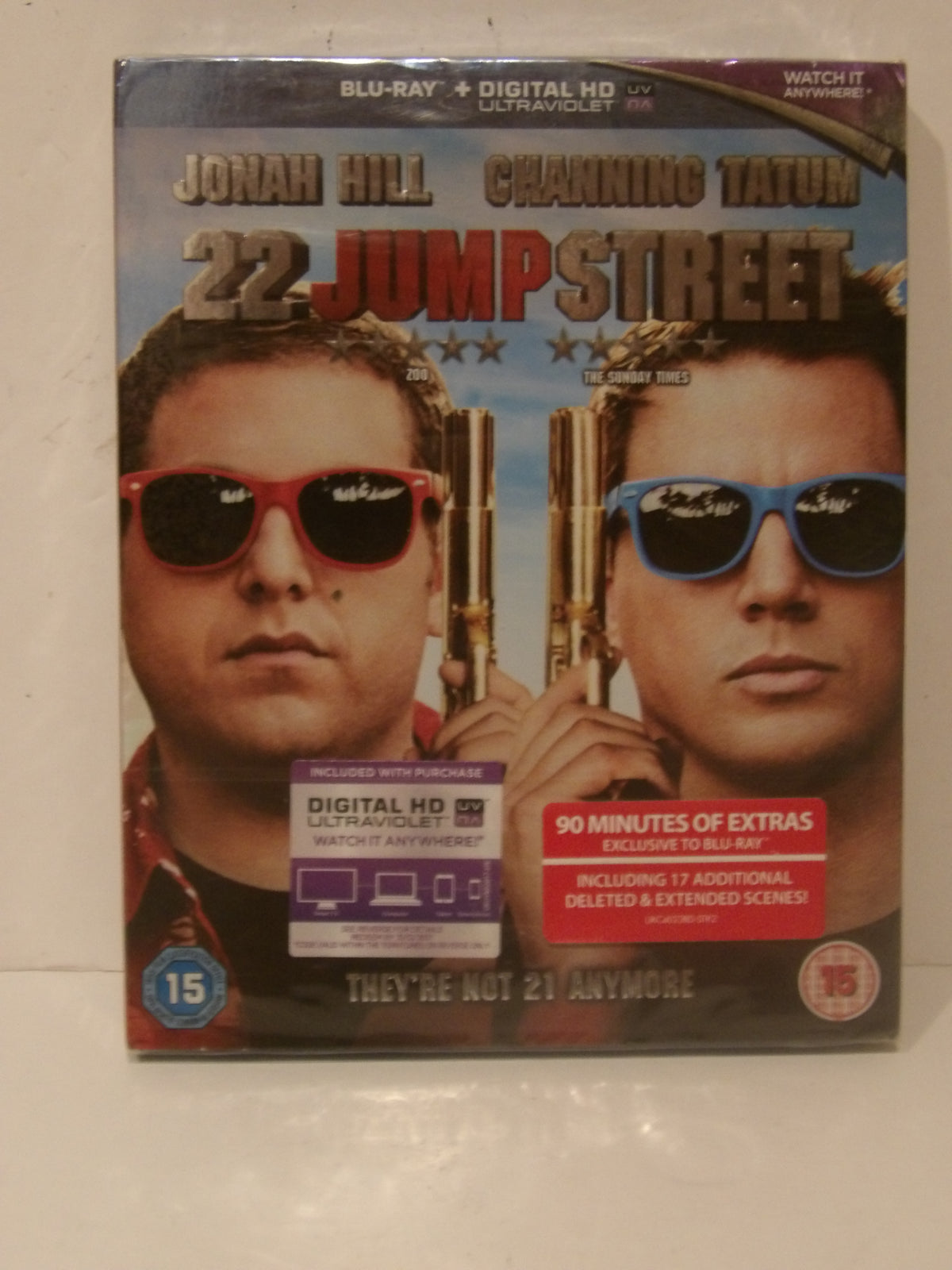 22 Jump Street Blu-ray and Digital HD combo pack featuring Jonah Hill and Channing Tatum in sunglasses, photographed on a light beige surface.