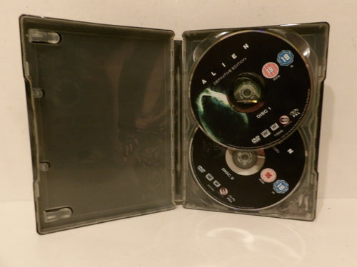 An open black plastic DVD case containing two Alien movie discs, photographed against a plain light background.
