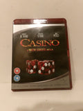 Casino movie Blu-ray case with a dark cover featuring the title in red and gold, plus two red dice with white pips, photographed against a plain off-white background.