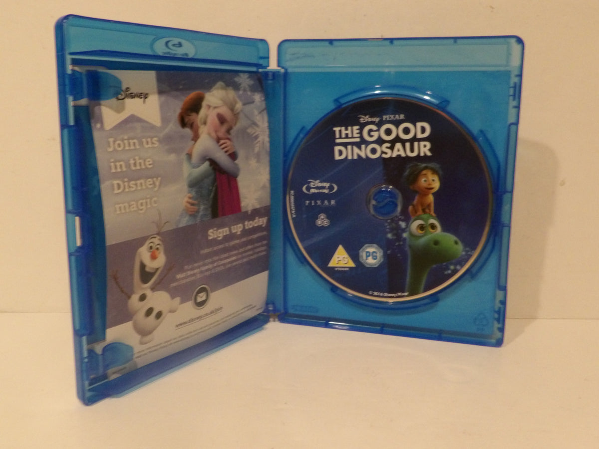 Disney Pixar The Good Dinosaur Blu-ray case shown open, with the blue plastic case displaying the Blu-ray disc and the front cover insert on a plain light background.