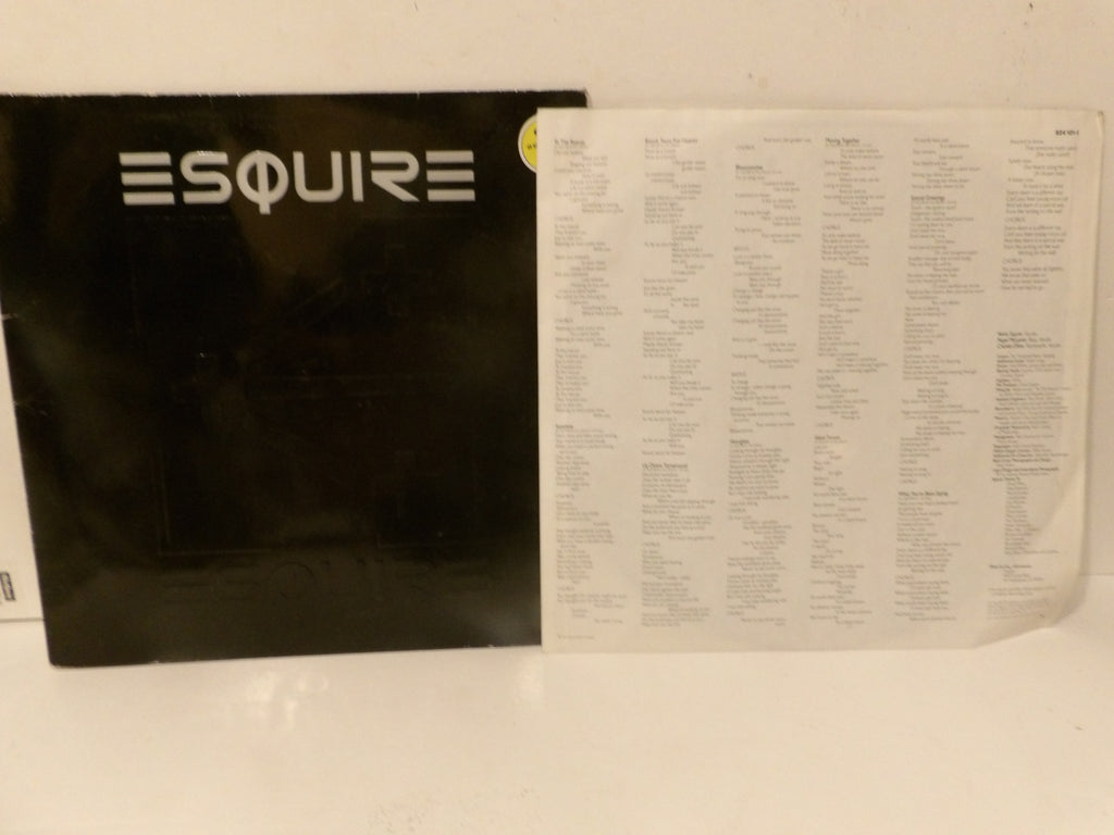 A black Esquire record sleeve with the word 'ESQUIRE' in white at the top, shown next to a white printed inner sleeve or insert with dense small text, photographed against a plain light background.