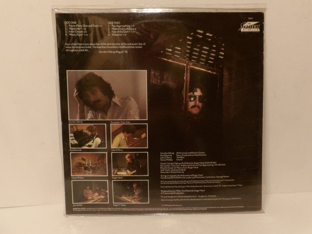 The back cover of a vinyl record sleeve for Bob Dylan's album 'The Two', sealed in its plastic shrink wrap and photographed against a plain white background.
