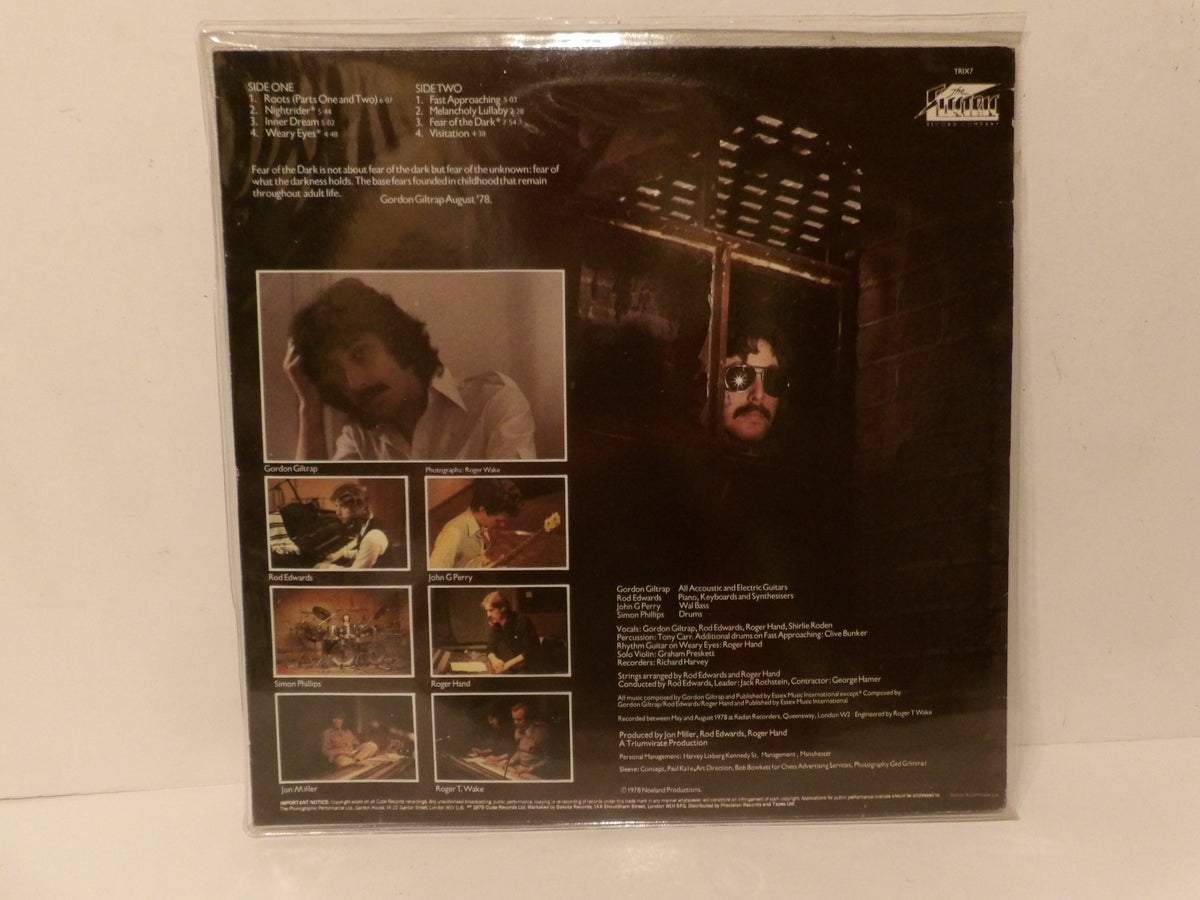 The back cover of a vinyl record sleeve for Bob Dylan's album 'The Two', sealed in its plastic shrink wrap and photographed against a plain white background.