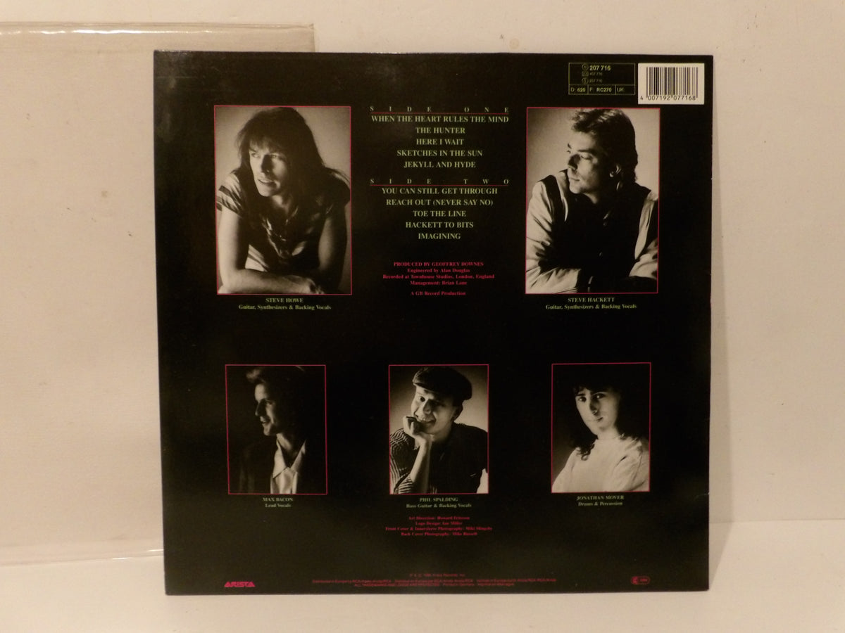 The back cover of a vinyl record sleeve for 'When the World Ends With Me' by The Who, displayed against a light background. The black cover features five black-and-white portrait photos of band members Roger Daltrey, Keith Moon, John Entwine, and Paul Weller, along with track listings and a barcode.
