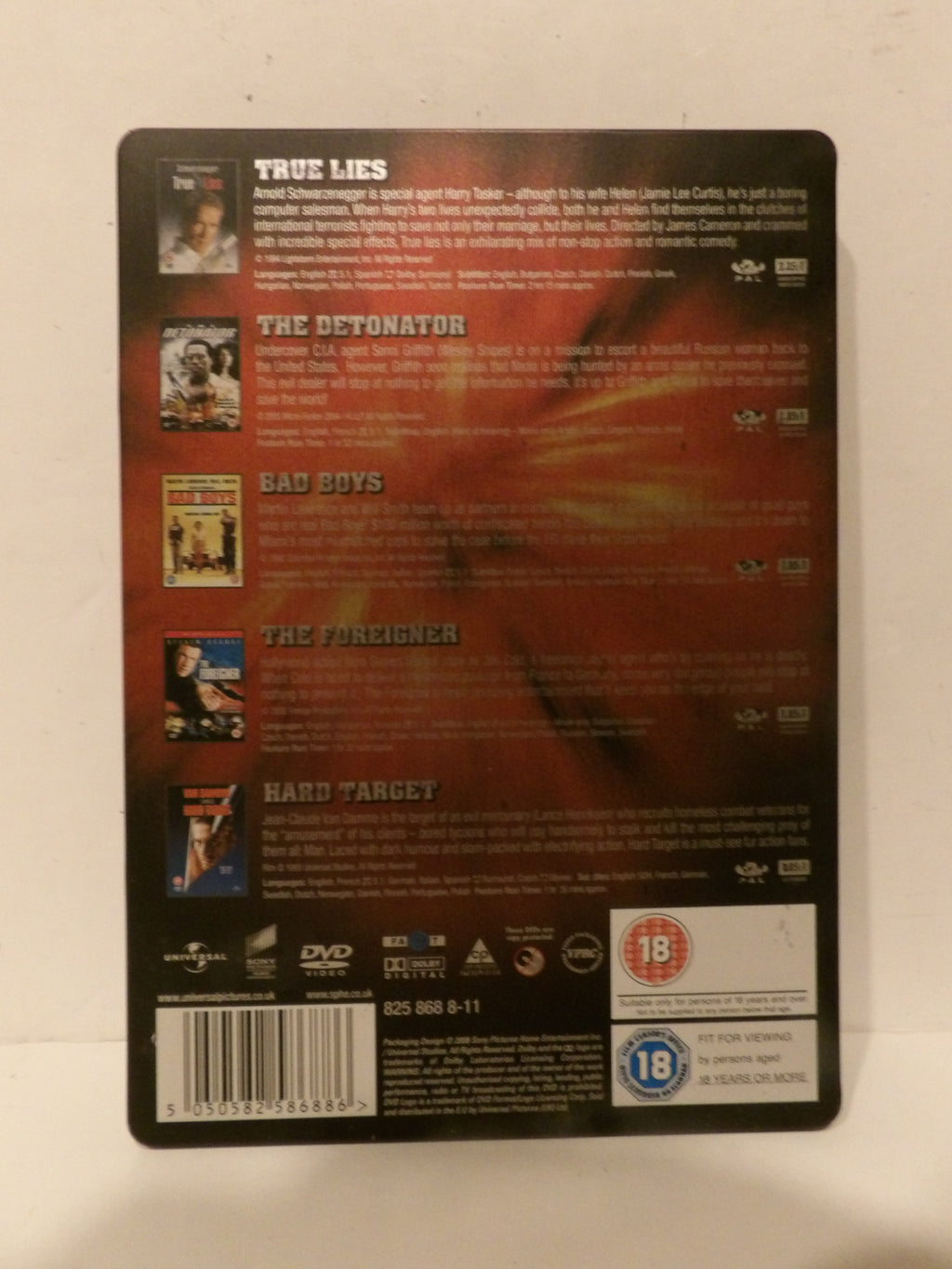 The back cover of a DVD box set for the movie series 'True Lies', showing various film titles, synopsis text, barcode, and age rating logos on a white background.