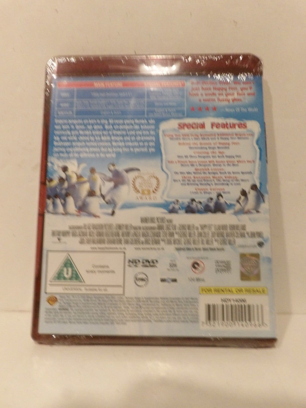 The back cover of a DVD case for 'Ice Age: The Great Meltdown', sealed in plastic shrink wrap, photographed against a light beige background.