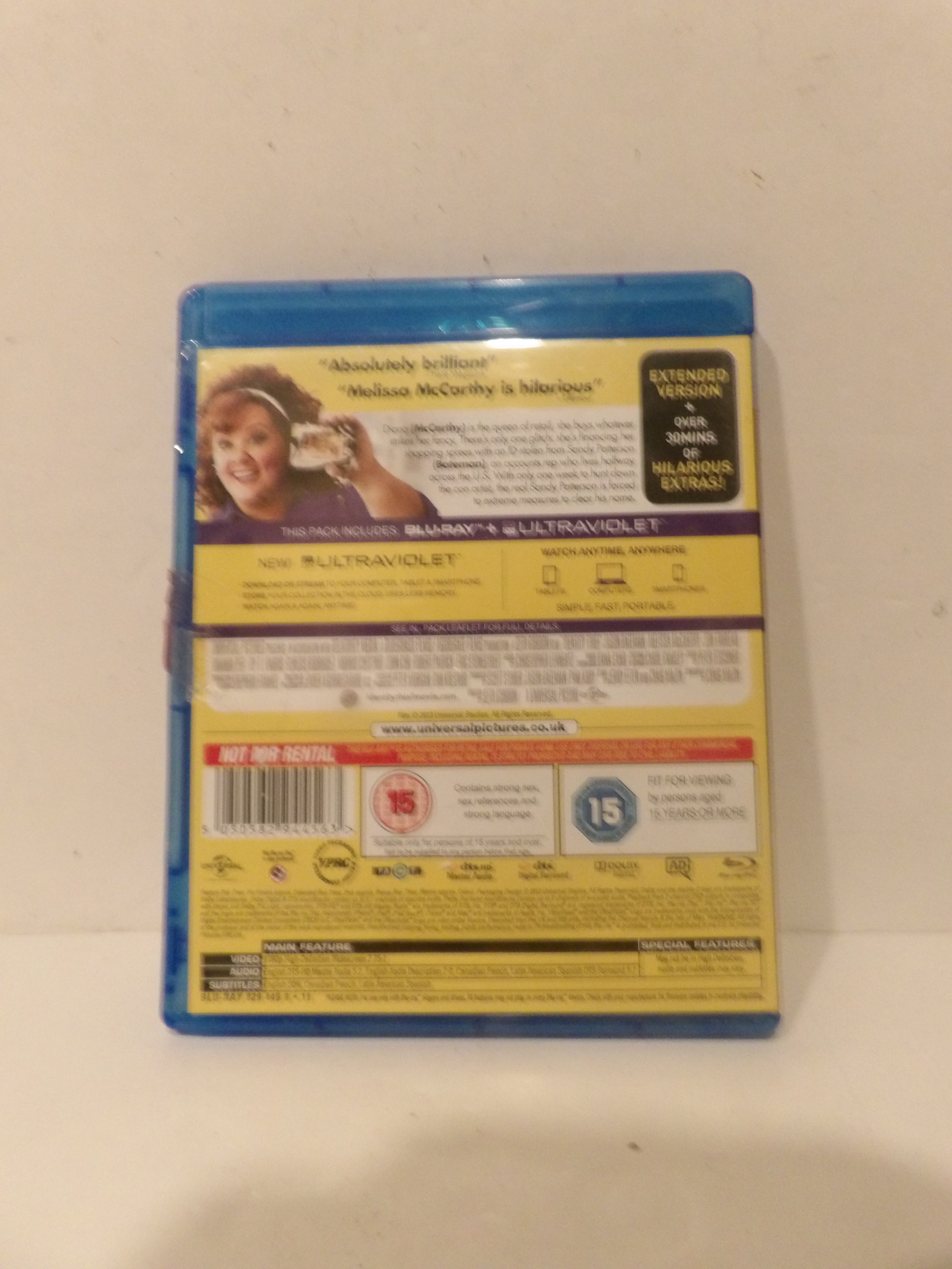 The back cover of a Blu-ray case for the movie 'Absolutely Scandalous' featuring Madeline McCorkley, photographed against a plain off-white background.