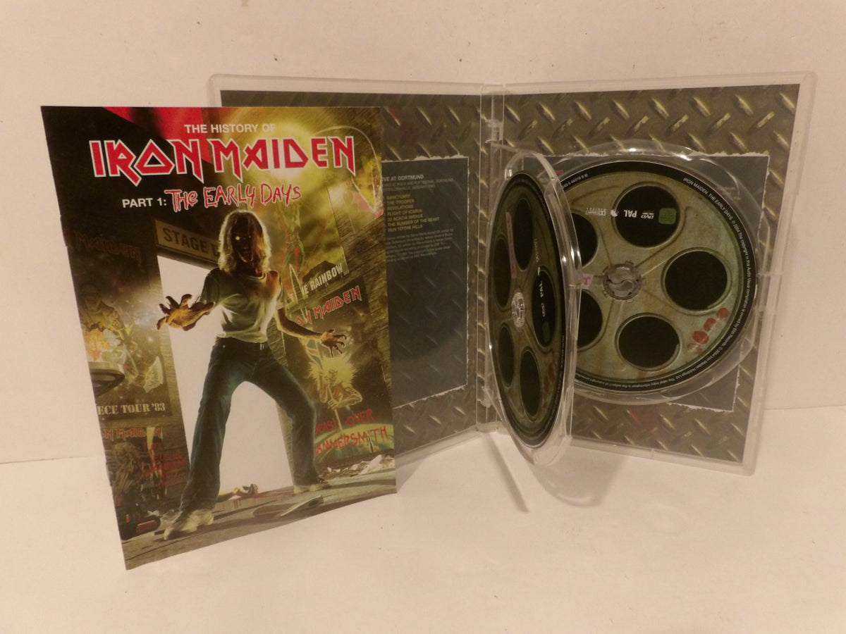 Iron Maiden 'The History of Iron Maiden: Part 1: The Eagle and the Dove' CD with printed booklet and a clear plastic case showing the disc inside, photographed on a white surface.