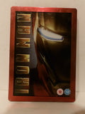 Iron Man steelbook case with a metallic red border and artwork of Iron Man's helmet and the vertical 'IRON MAN' title, photographed against a light background.