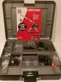 Open Meccano Engineering and Robotics kit storage case showing the gray plastic organizer tray filled with parts and tools, with the red and white Meccano instruction card standing inside the lid.