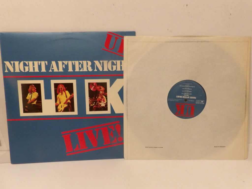A vinyl record album shown with its printed cover sleeve on the left and the record sleeve on the right, revealing a pale translucent record inside. The cover is blue with large white lettering reading 'NIGHT AFTER NIGHT' and red 'LIVE!' text, plus three small portrait photos.