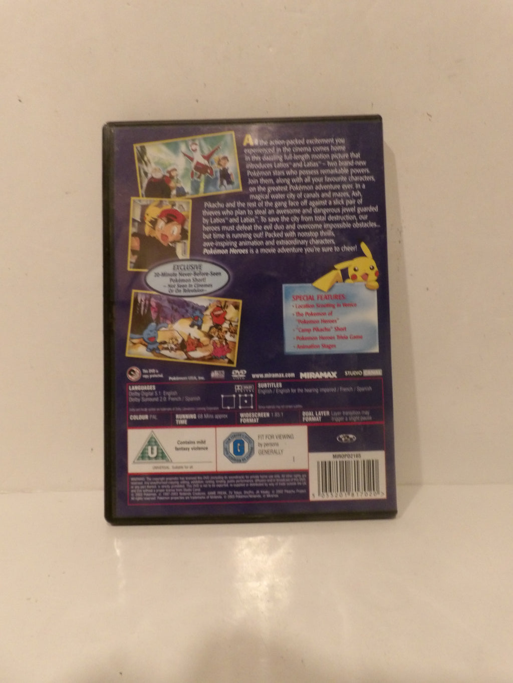 The back cover of a Pokémon DVD case, featuring character artwork, synopsis text, and rating logos on a light-colored surface.