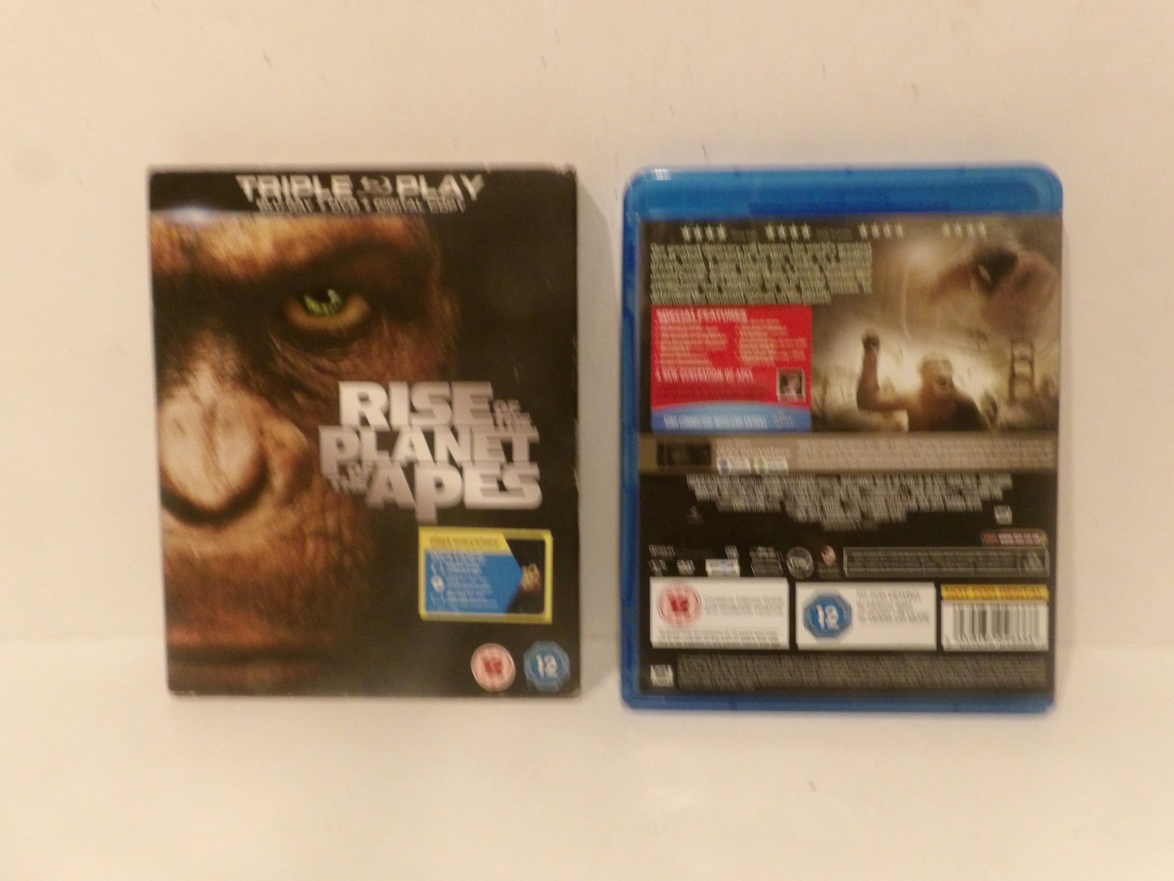 Front and back views of the Blu-ray case for the movie 'Rise of the Planet of Apes' on a plain light background.