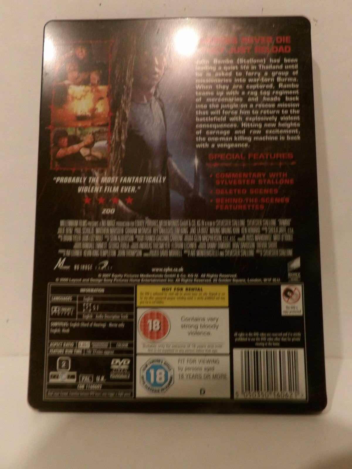 The back cover of a DVD case for the movie 'Zodiac' (2007), featuring a dark design with character artwork, critical quotes, and product details including a 18 rating logo.