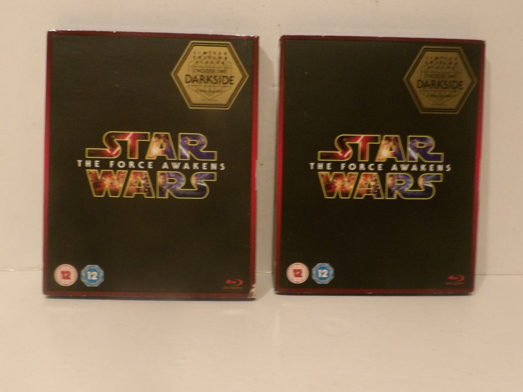 Two Star Wars: The Force Awakens Darkside Blu-ray cases standing upright on a white surface. The cases are black with red borders, gold 'Darkside' badges, and the Star Wars logo in the center.
