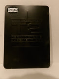 A black limited edition collectible plaque or cover for 'T2: Swatwheels', featuring embossed lettering and a small 'Limited Edition' sticker in the top left corner.