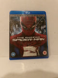 A Blu-ray case of The Amazing Spider-Man 1, featuring Spider-Man on the cover with a blue plastic case border, photographed on a light-colored surface.