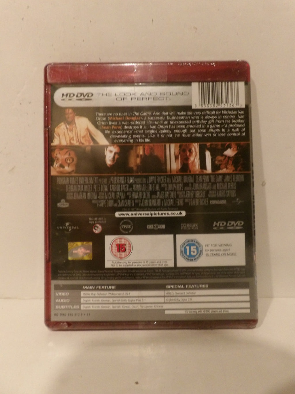 The back cover of a physical HD DVD movie case for 'The Luck and Sound of Perfect', showing the barcode, synopsis, and release details on a plain off-white background.