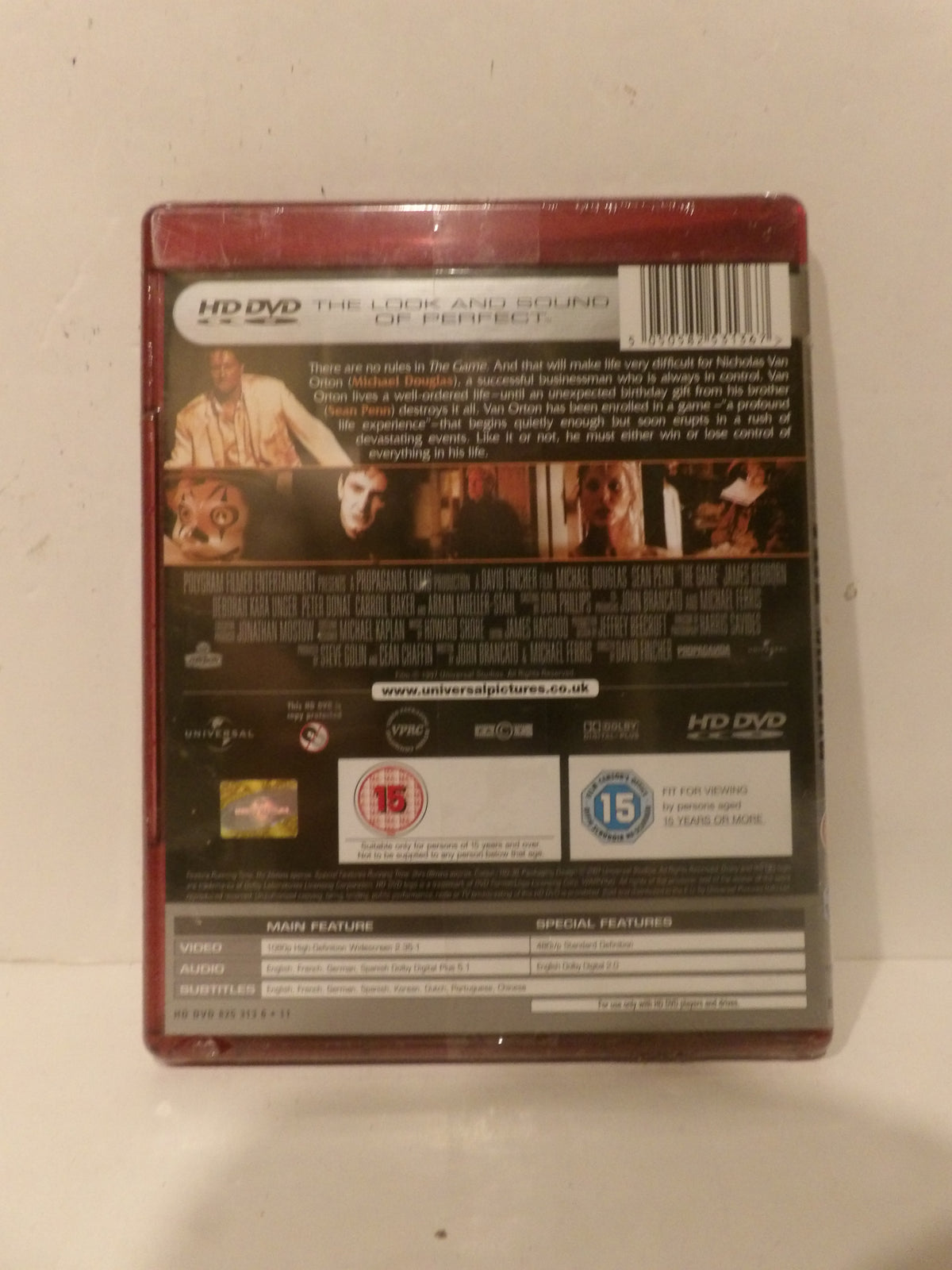 The back cover of a physical HD DVD movie case for 'The Luck and Sound of Perfect', showing the barcode, synopsis, and release details on a plain off-white background.