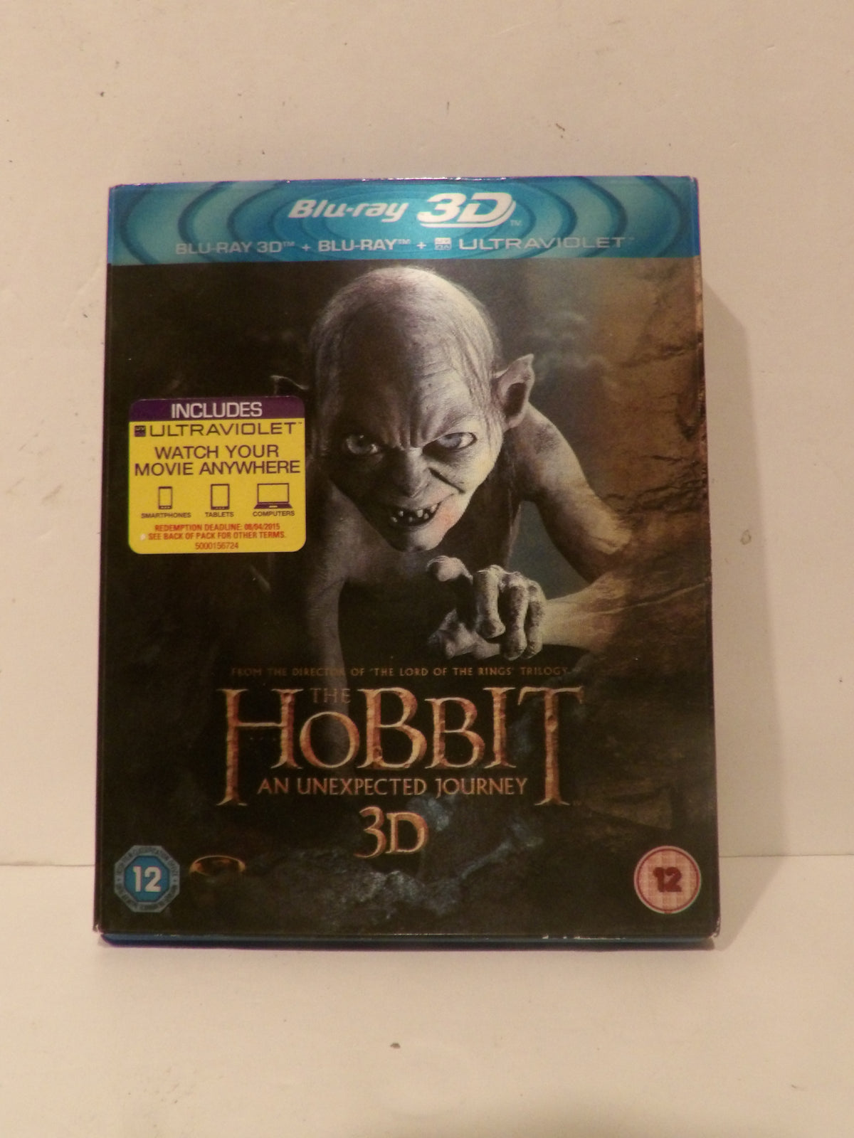 A boxed Blu-ray 3D release of 'The Hobbit: An Unexpected Journey' standing upright against a plain light background. The cover shows a dark fantasy creature and the title in large gold lettering, with a yellow 'Includes UltraViolet watch your movie anywhere' sticker on the left.
