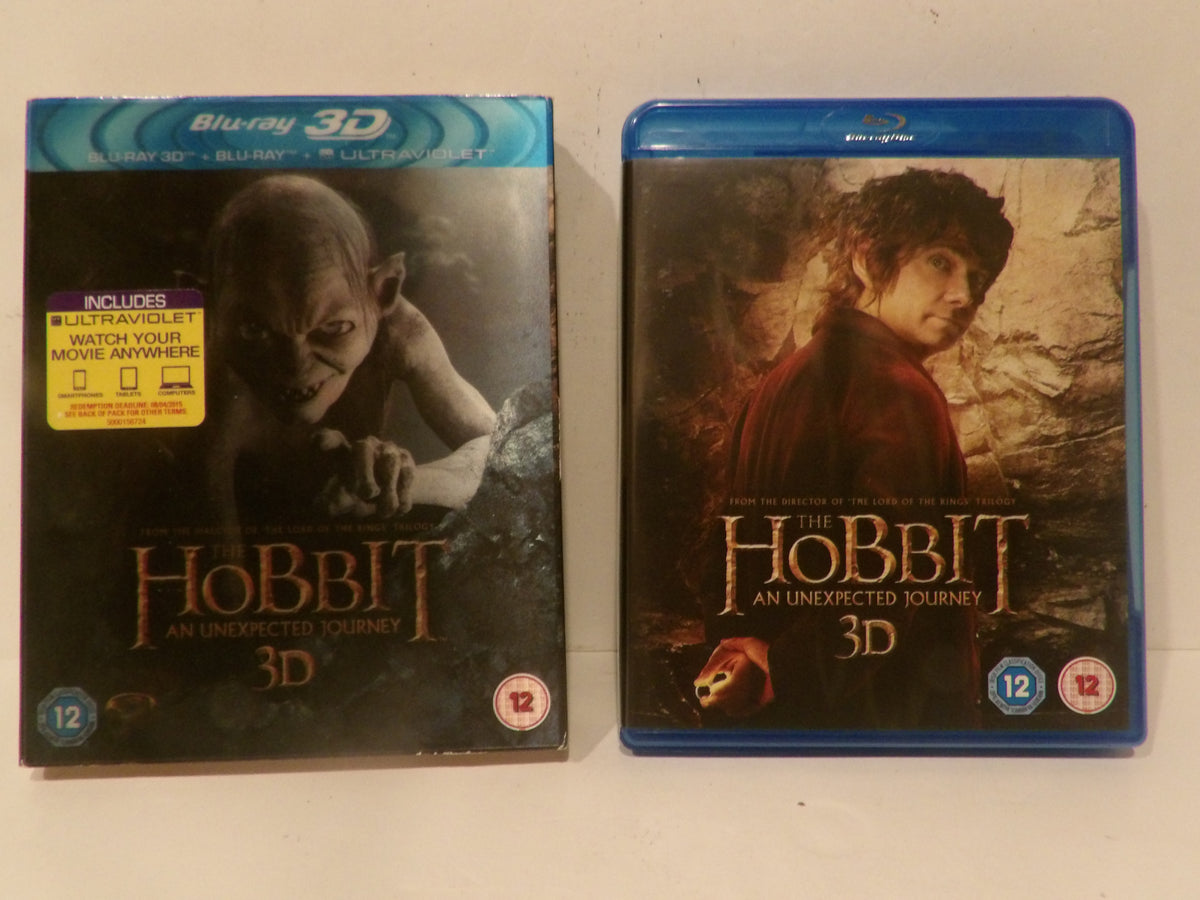 Two Blu-ray cases for The Hobbit: An Unexpected Journey 3D, shown side by side on a plain light background. The left case is a standard DVD-style case with a yellow notice sticker, and the right case is a blue Blu-ray case.