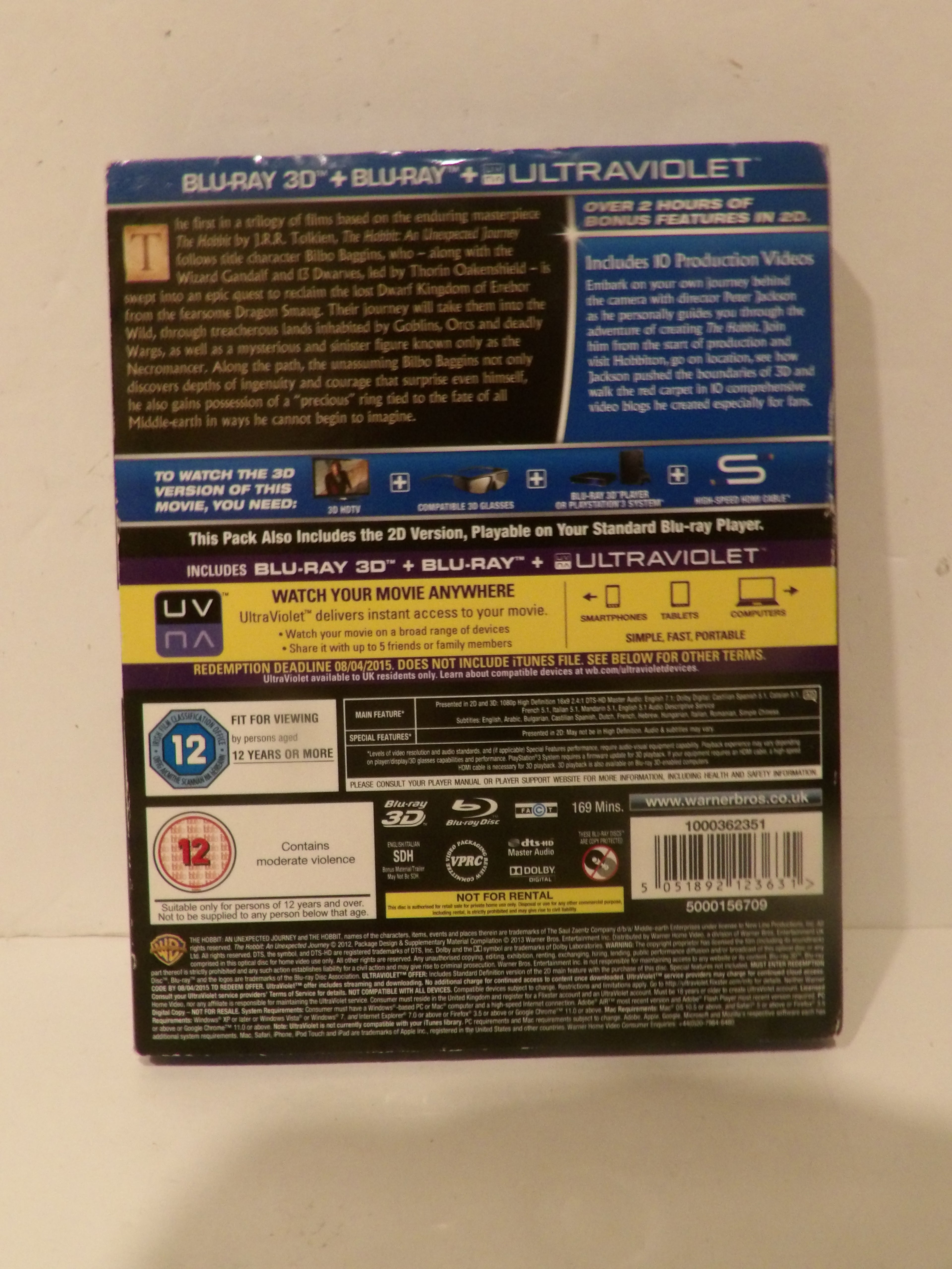 Two Blu-ray 3D + Blu-ray + Ultraviolet movie cases shown from the back, one in a blue plastic case and one in a black case, standing upright on a white surface.