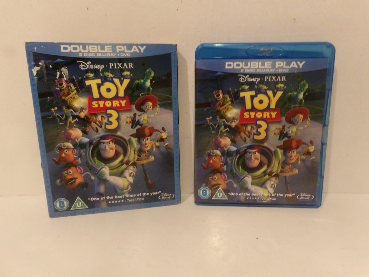 Two Disney Pixar Toy Story 3 double play Blu-ray cases standing upright on a white surface, one showing the front cover and the other showing the Blu-ray case side with the cover partially visible.