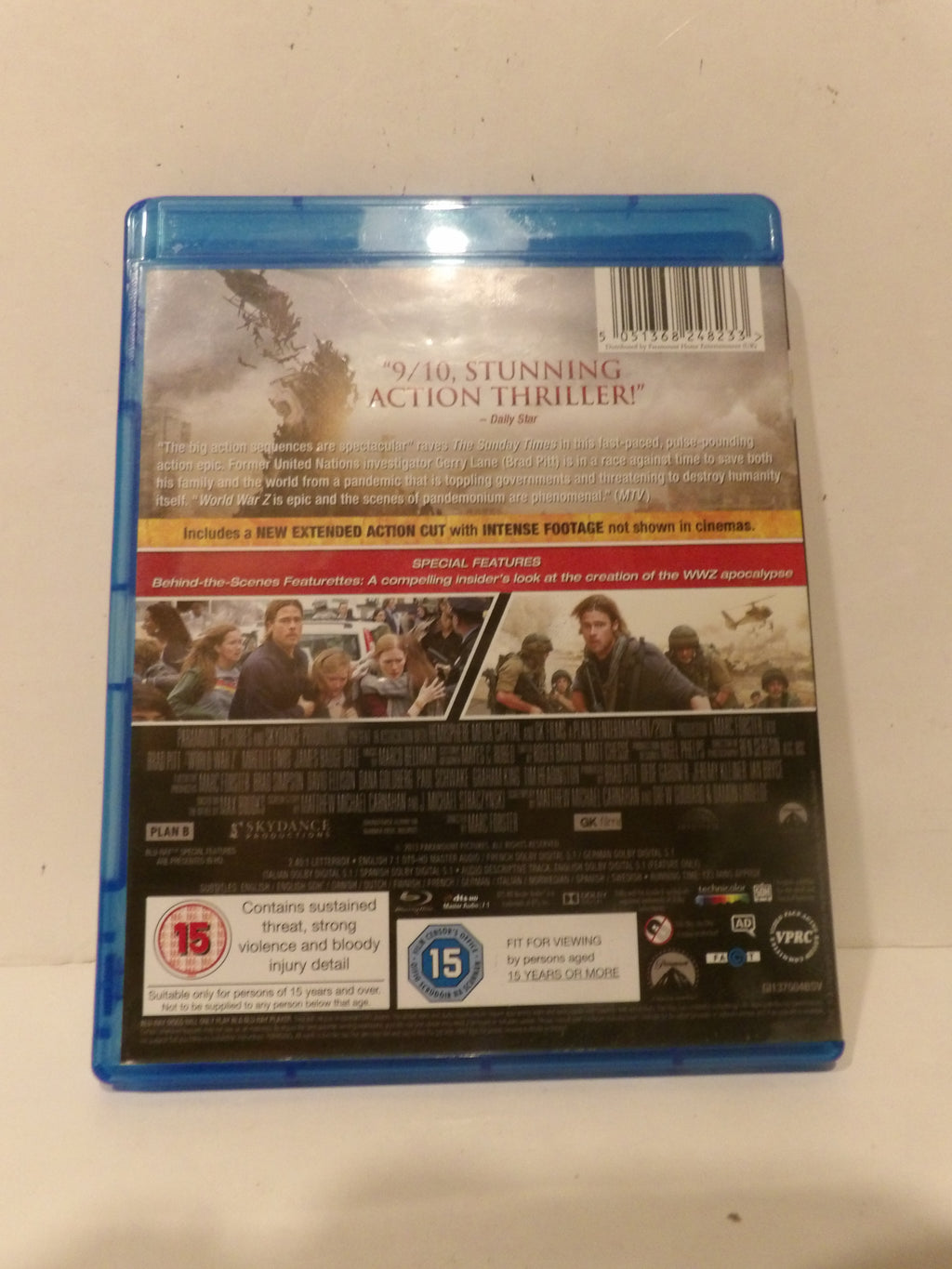 Back cover of a Blu-ray case for the action thriller film '4/10 Stunning Action Thriller', photographed on a light beige surface.